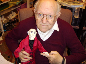 hertzholdingnosferatupuppet.jpg,professor hertz,scarlet moon movie,invasion for flesh and blood, flesh eaters from outer space,ny times critics choice,horror,sci fi,great nj movie,nj feature film maker,splatter cinema,blood,animation,alice cooper,godzilla,dracula,vampires,horror movies,serial killers, sex,world renoun,violene, imaginative,auteur,thrills,monmouth county,stephen king,new jersey motion pictures,smith,blood,scary magazine,fangoria